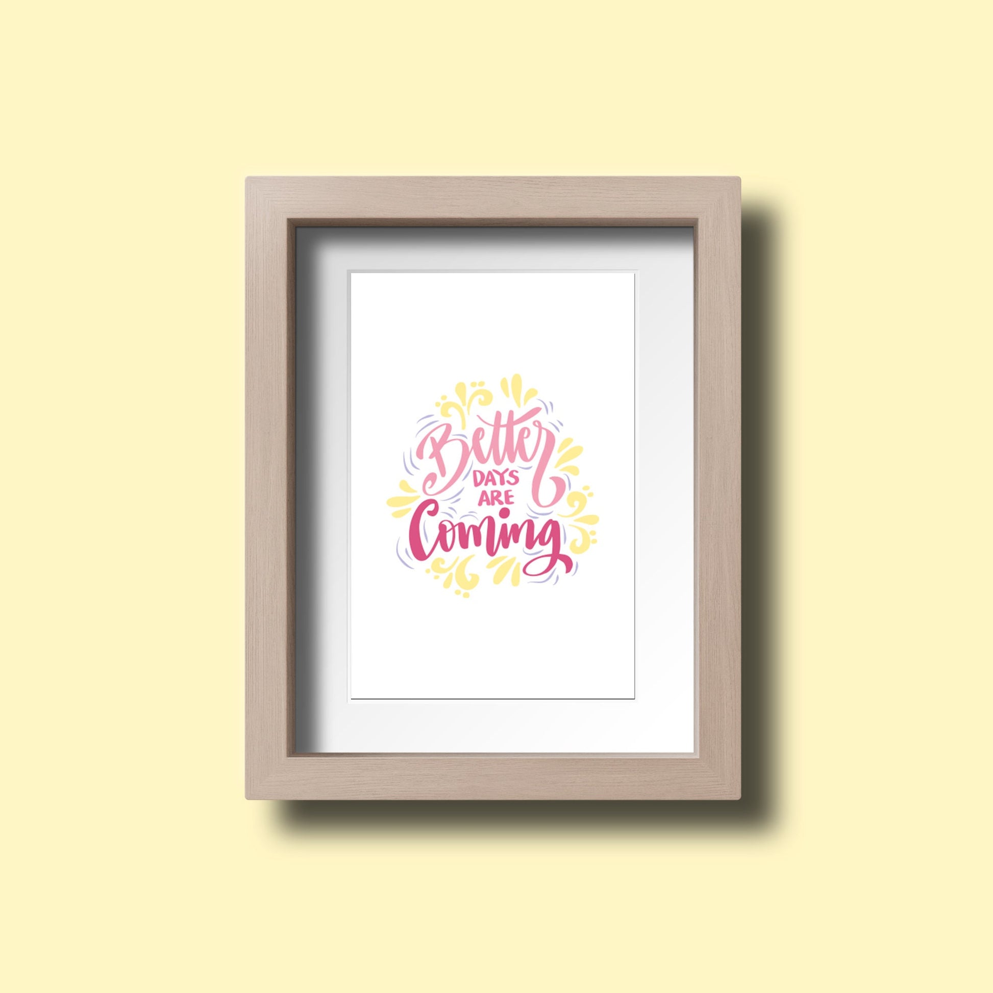 Framed artwork with 'Better Days Are Coming' text on a yellow wall