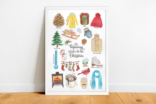 Framed artwork with winter-themed illustrations on a white wall.